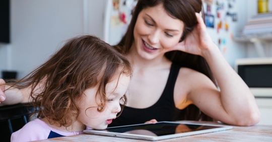 a mother and her daughter doing homework